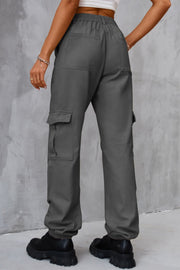 Dark gray utility cargo trousers with elasticated cuffs and multiple pockets.
