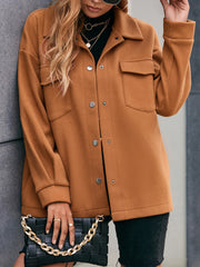 Oversized caramel utility jacket with snap closure and chest pockets.