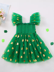 Green tulle dress with gold shamrock print, smocked bodice, and flutter sleeves.