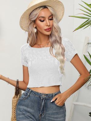 White cable knit crop top with square neckline and short sleeves.