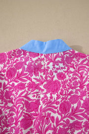 Vibrant floral midi dress with a blue collar and pink floral pattern.