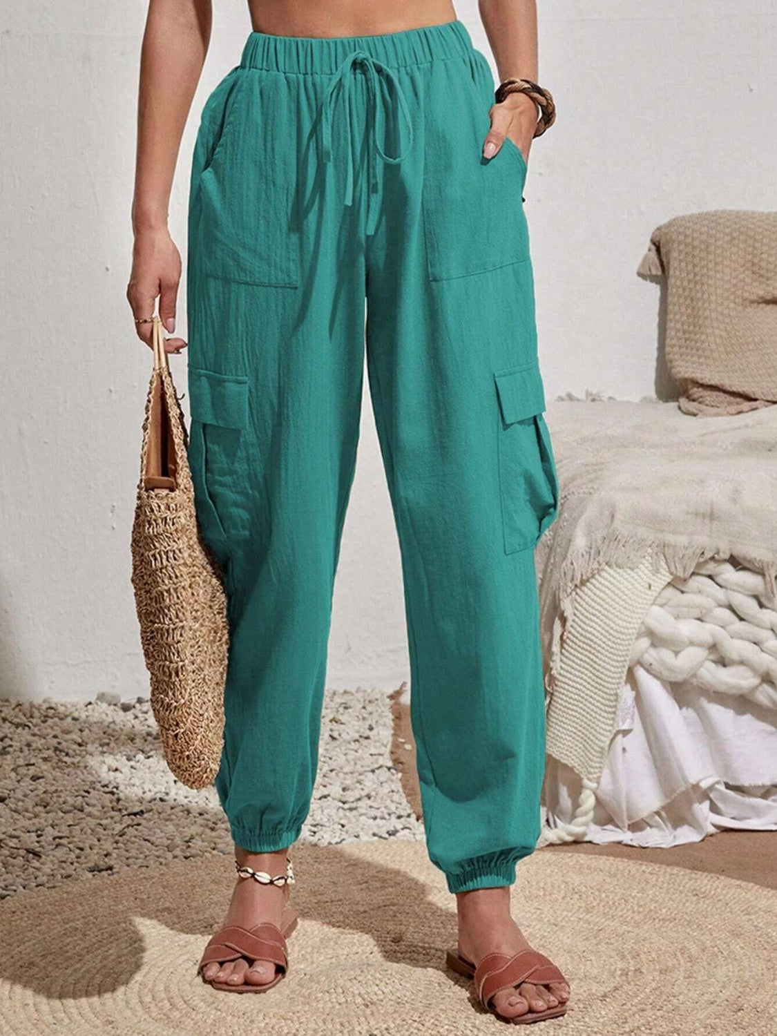 Textured cargo lounge trousers in turquoise with drawstring waist and elastic cuffs.
