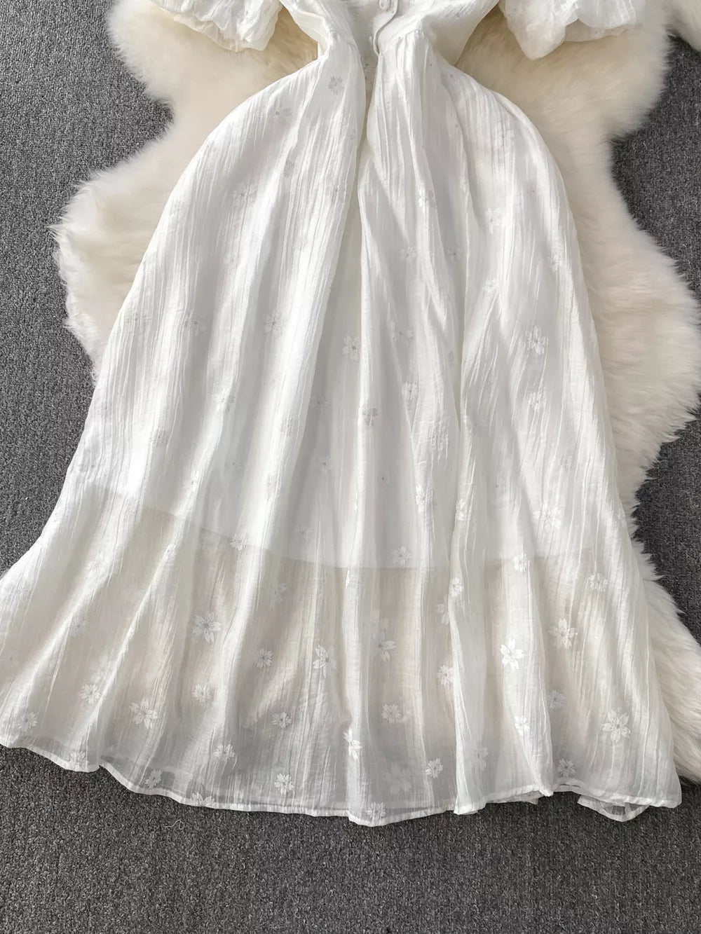 White embroidered puff sleeve midi dress with a-line skirt and button detail
