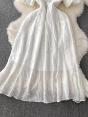 White embroidered puff sleeve midi dress with a-line skirt and button detail