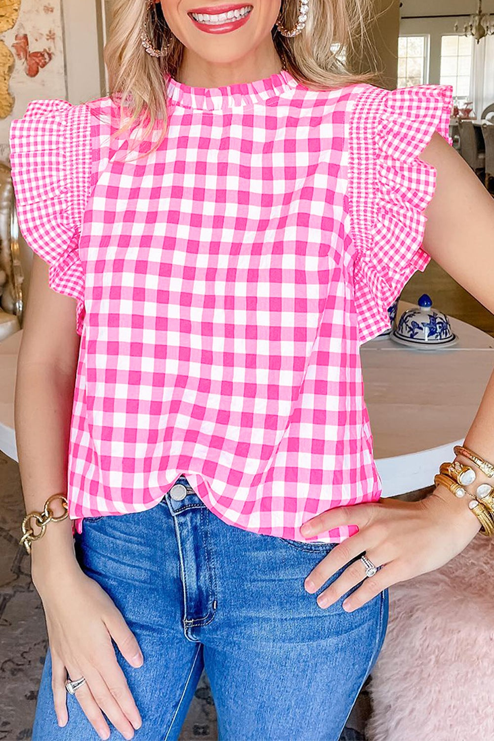 Fuchsia pink gingham blouse with ruffle sleeves and mock neck.