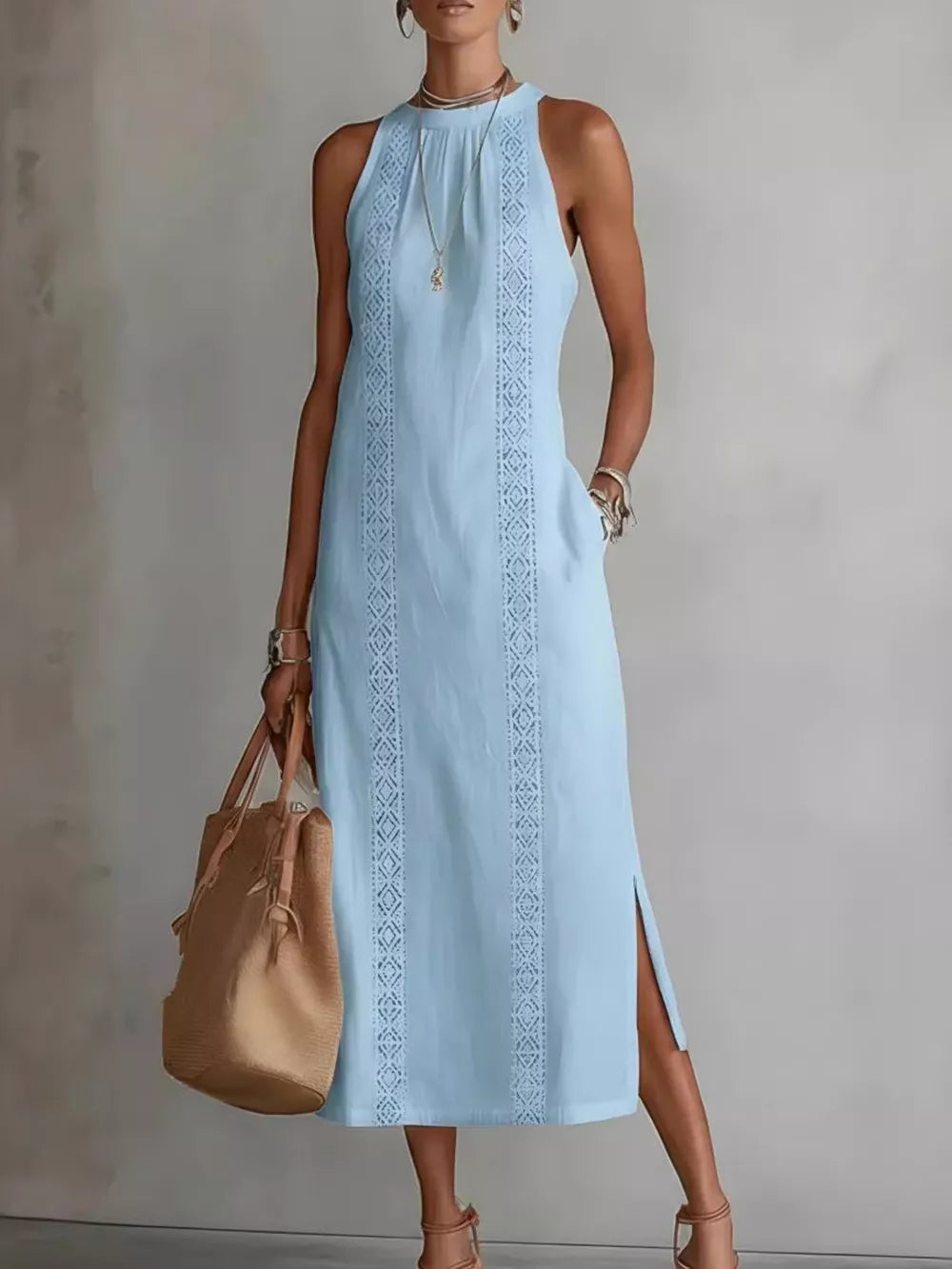 Sky blue sleeveless midi dress with geometric trim and pockets.
