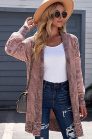 Pink textured puff sleeve open cardigan with a white tank and distressed jeans.