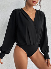 Black surplice bodysuit with balloon sleeves and a V-neckline.
