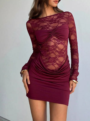 Burgundy lace backless ruched mini dress with draped skirt and long sleeves.