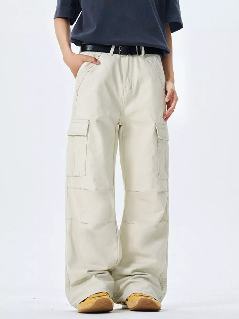 Off-white 100 cotton wide-leg cargo pants with multiple pockets and belt loops.