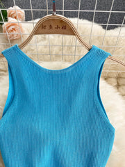 Light blue ribbed knit midi dress with a scoop neck and sleeveless design.