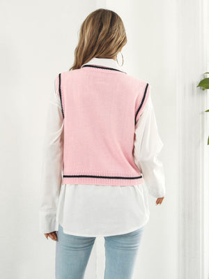 Blush pink acrylic knit vest with black trim, crew neck, sleeveless, argyle detail.