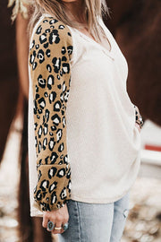 White waffle knit top with leopard print sleeves and v-neck