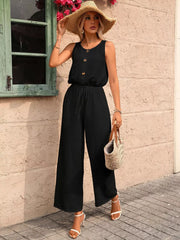 Black wide-leg romper with button detail and drawstring waist, perfect for maternity wear.