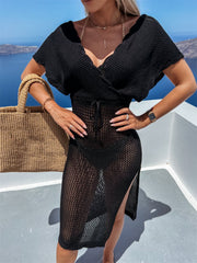 Black knit wrap cover-up with V-neck, short sleeves, drawstring waist, and high slit.