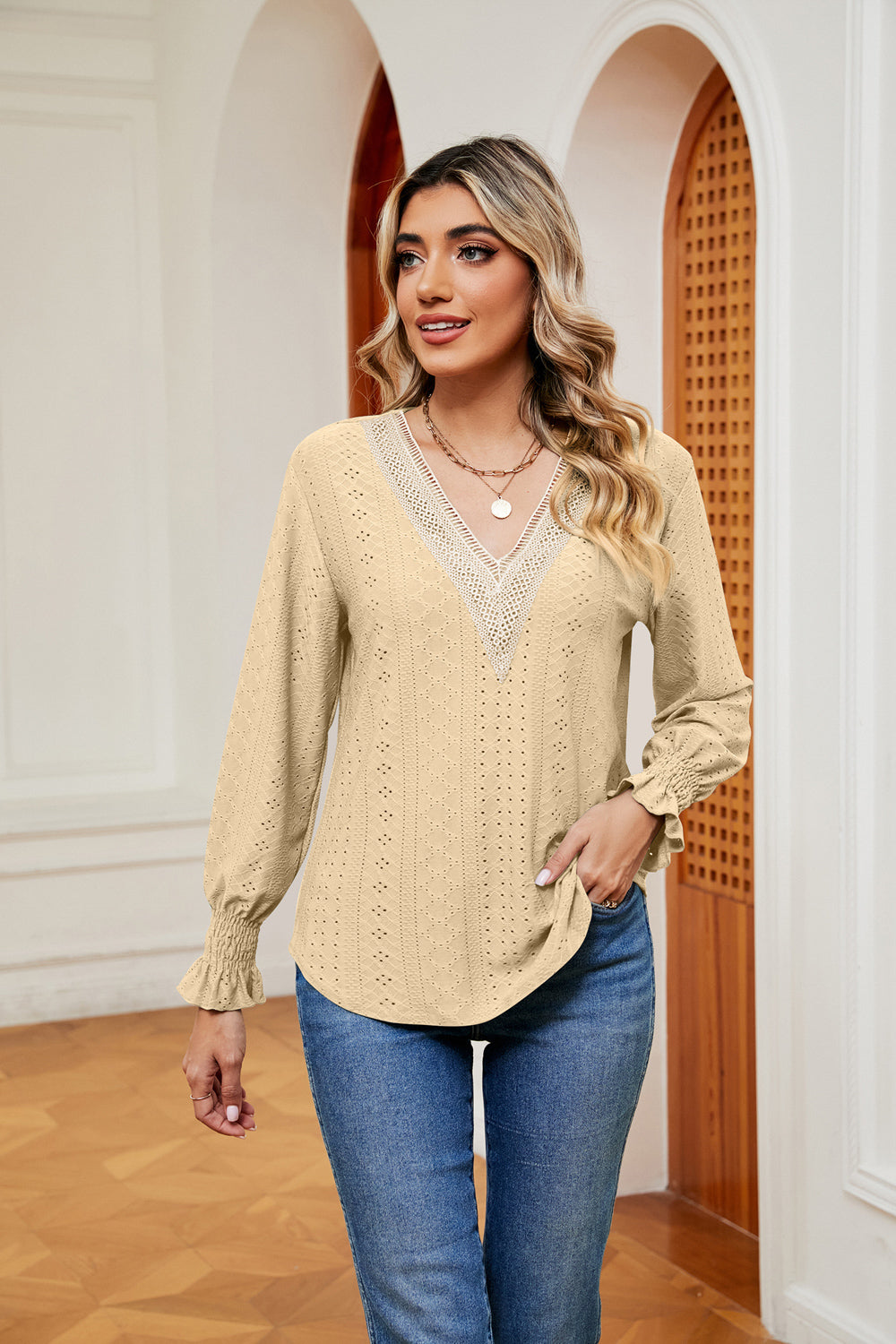 Pastel yellow eyelet blouse with lace trim V-neck and ruffle cuffs.