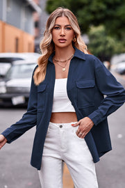 Dark blue oversized utility shirt with two chest pockets and button cuffs.