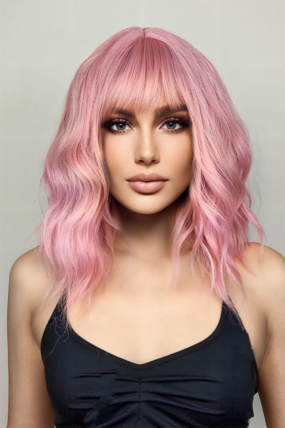 Pink bob wig with bangs and wavy texture