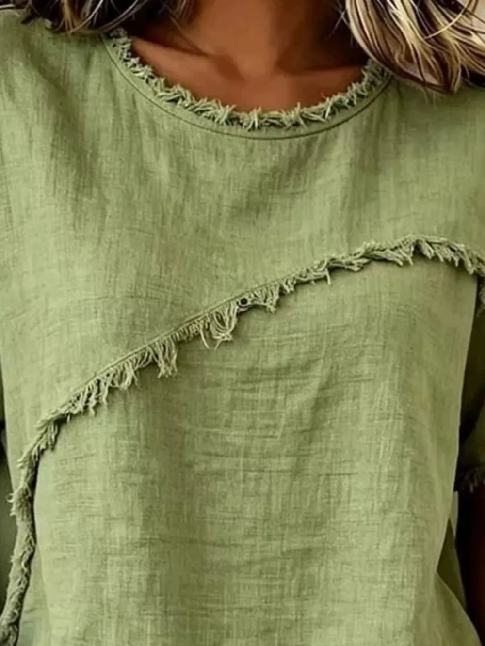 Green crew neck shirt with frayed asymmetrical detail and hem