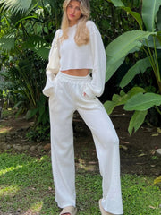 White waffle knit cropped lounge set with wide leg pants and crewneck sweater.