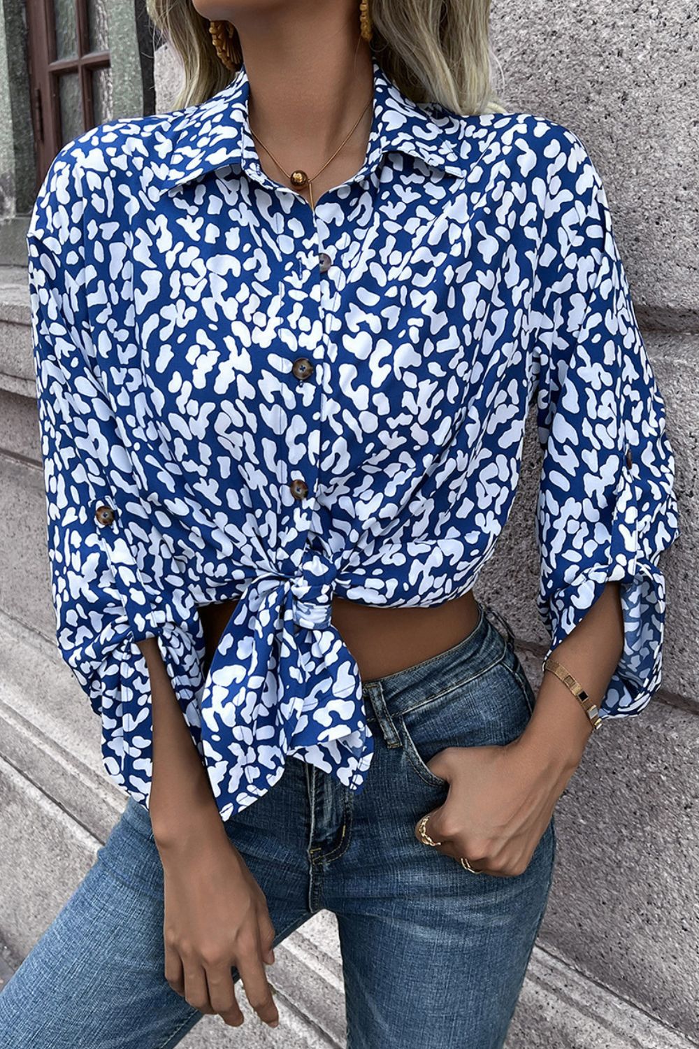 Sky blue abstract spot print oversized buttoned shirt with knotted hem.