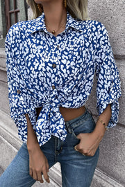 Sky blue abstract spot print oversized buttoned shirt with knotted hem.