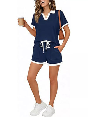 Navy blue polo collar two-piece set with white trim, drawstring shorts and short sleeves.
