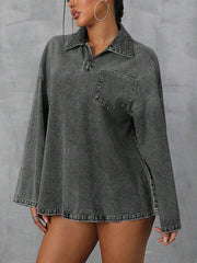 Oversized dark denim polo shirt with a quarter zip, collared neckline, and chest pocket.