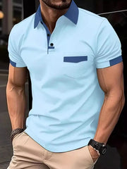 Color-blocked polo shirt in mint blue with navy accents on collar, pocket, and sleeves.