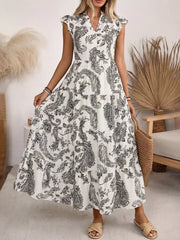 Paisley print maternity maxi dress with ruffled cap sleeves and notched neckline.