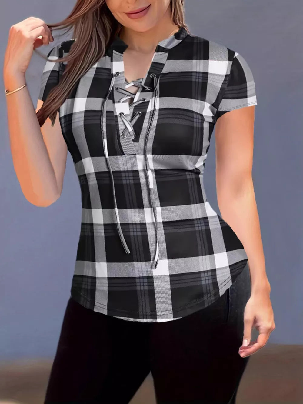 Lace-up plaid short sleeve shirt with curved hem in black and white.