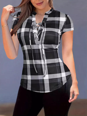 Lace-up plaid short sleeve shirt with curved hem in black and white.