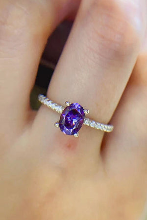 Amethyst oval pavé ring with a bright purple stone and diamond band.