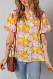 Puff sleeve blouse with ruffle trim in a bold floral print.