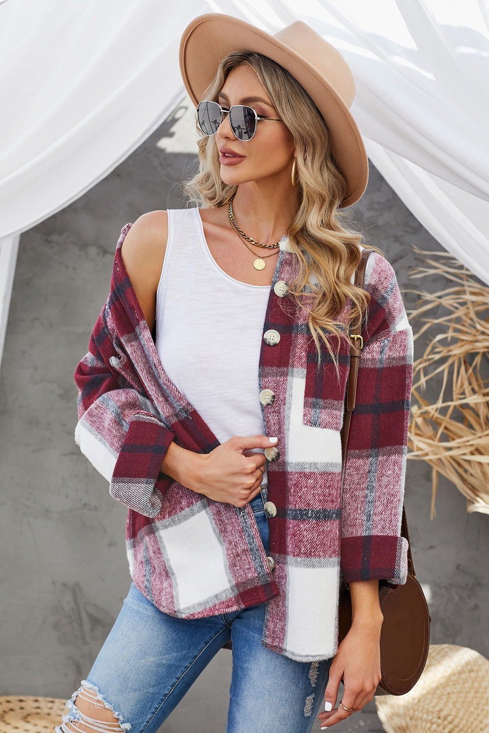 Oversized shacket in burgundy plaid with button front and patch pocket.