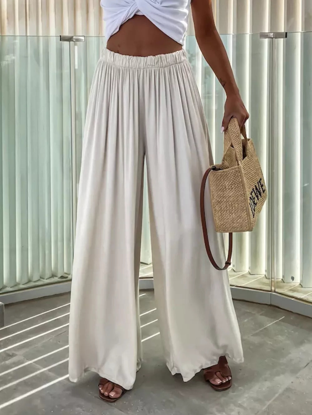 Maternity paperbag waist pants in apricot, wide leg, cotton, with adjustable waistband.
