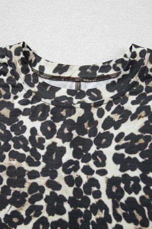 Relaxed leopard print loungewear top with crewneck and detailed stitching.