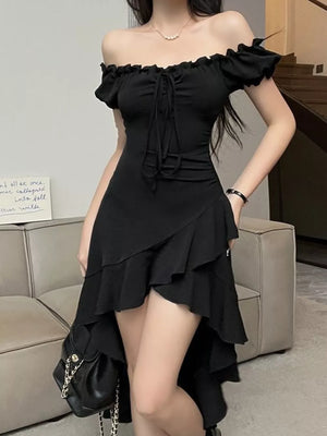Black off-shoulder dress with ruffled asymmetrical hem and tie front.