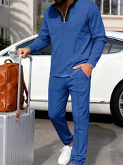 Royal blue casual two-piece set with zippered top and track pants.