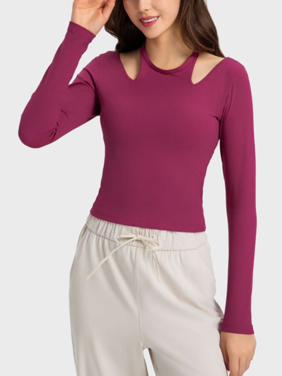 Ribbed long sleeve activewear top in magenta with cutout shoulders