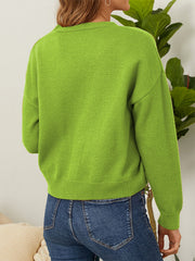 Mid Green V-neck cardigan with button front and daisy embroidery detail.