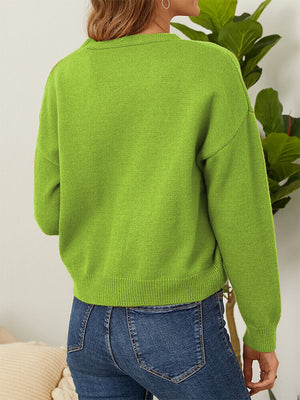 Mid Green V-neck cardigan with button front and daisy embroidery detail.