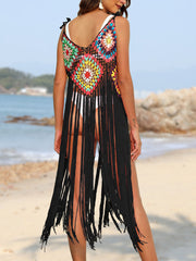 Crochet patchwork cover-up dress with multicolor squares and long black fringe.