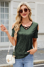 Dark green sequin cold shoulder top with crisscross neckline detail.