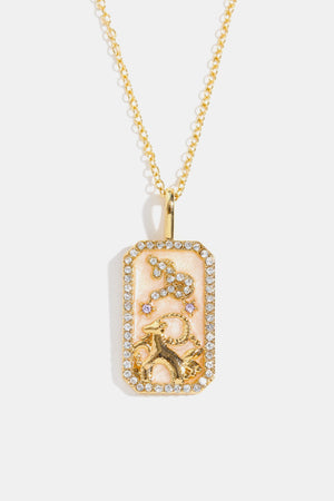14K gold-plated Capricorn zodiac sign crystal pendant necklace with pink enamel and rhinestones.