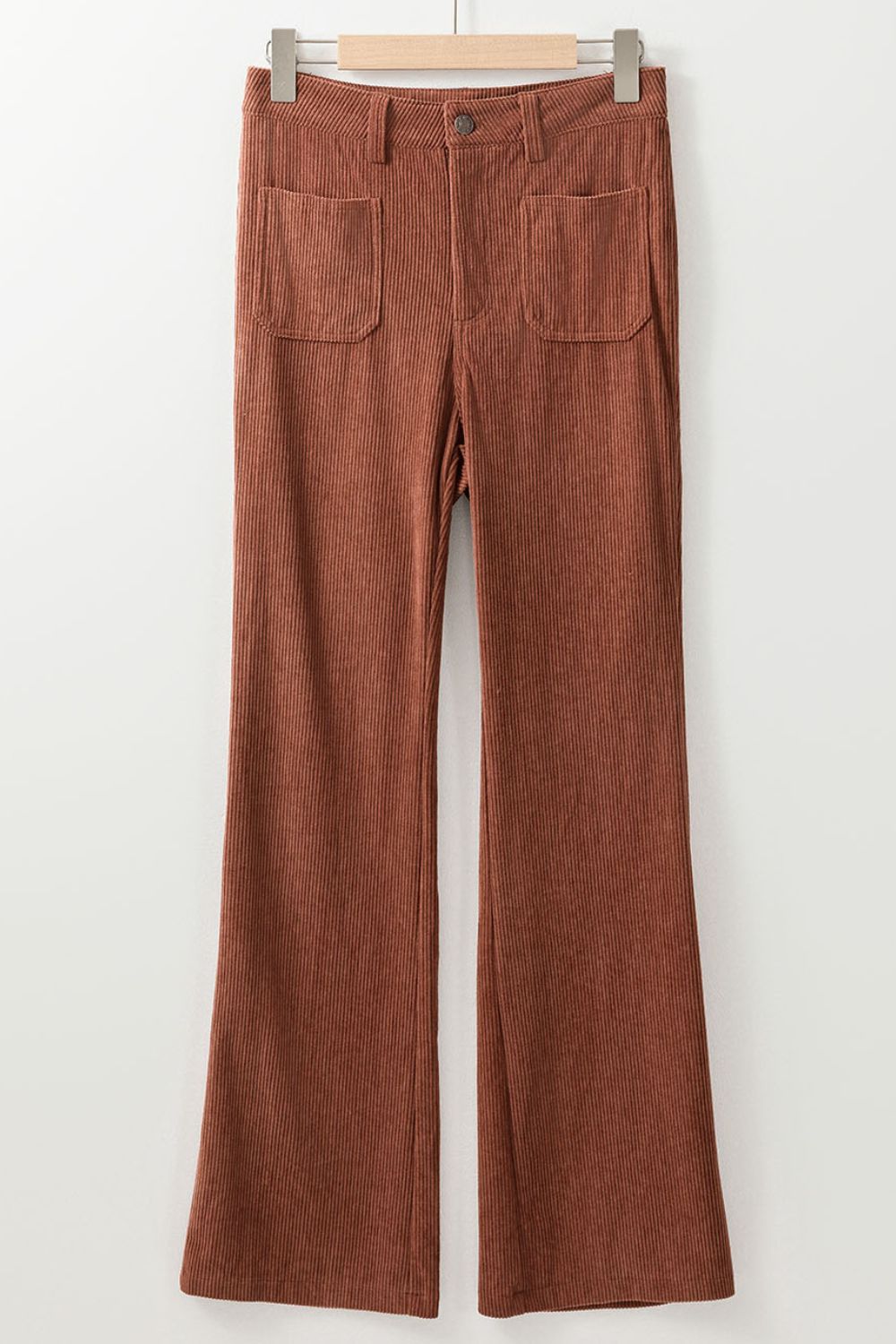Brown corduroy flared leg trousers with front patch pockets and a button closure.