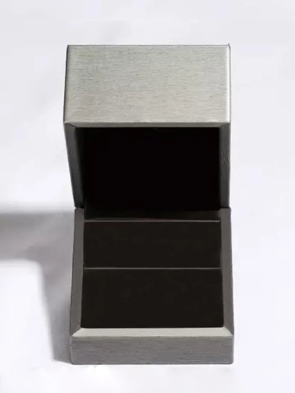 Emerald Prism Silver Ring jewelry box with brushed silver lid and dark interior.