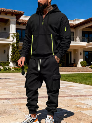 Black half-zip hoodie with neon accents and matching cargo sweatpants set.