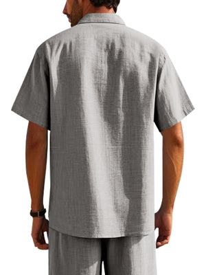 Grey short sleeve button-down shirt with pockets, collared, casual breathable fabric.