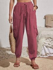 Textured cargo lounge trousers in dusty pink with drawstring waist and cuffed ankles.